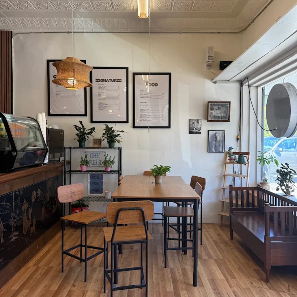Bliss Cafe seating area with wooden tables and window seating